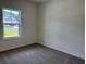A cozy bedroom featuring neutral carpeting and a bright window at 323 Palmetto Sand Loop, Conway, SC 29527