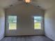 Bedroom with two bright windows at 323 Palmetto Sand Loop, Conway, SC 29527