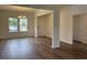 Inviting dining area with hardwood floors, chandelier, and large windows at 323 Palmetto Sand Loop, Conway, SC 29527