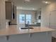 Modern kitchen featuring quartz countertops, stainless steel appliances, and ample cabinet space at 323 Palmetto Sand Loop, Conway, SC 29527