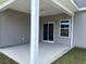 Covered outdoor patio area with ceiling fan at 323 Palmetto Sand Loop, Conway, SC 29527