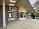 Expansive back porch with brick accents, skylights, and an abundance of windows offering scenic views at 3774 Annandale Dr., Myrtle Beach, SC 29577
