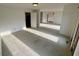 Open-concept living area featuring neutral carpet and ample natural light creating a bright and airy atmosphere at 3774 Annandale Dr., Myrtle Beach, SC 29577