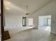 Living room showcasing vaulted ceiling, a ceiling fan, and neutral walls at 3774 Annandale Dr., Myrtle Beach, SC 29577