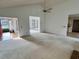 Bright living room boasts vaulted ceilings, white walls, and neutral carpet at 3774 Annandale Dr., Myrtle Beach, SC 29577
