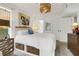 Bright bedroom with decorative lighting, storage under the bed, and modern furnishings at 4601 Greenbriar Dr. # 205A, Little River, SC 29566