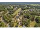 Aerial view showcasing a golf course and beautiful community surrounded by lush trees at 5012 Lindrick Ct., Myrtle Beach, SC 29579