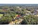 Aerial shot shows wooded acreage with golf course nearby at 5012 Lindrick Ct., Myrtle Beach, SC 29579