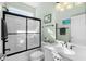 The bathroom showcases a modern vanity, a shower with glass doors, and framed art at 5012 Lindrick Ct., Myrtle Beach, SC 29579