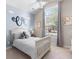 This charming bedroom offers bright natural light, a ceiling fan, and neutral paint at 5012 Lindrick Ct., Myrtle Beach, SC 29579