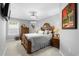 This bedroom has a ceiling fan, natural light, and wooden furniture to complete the classic look at 5012 Lindrick Ct., Myrtle Beach, SC 29579