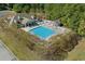 Aerial view of a large community pool with plenty of seating and a covered pavilion at 5012 Lindrick Ct., Myrtle Beach, SC 29579