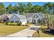 Charming one-story home with landscaped yard, large driveway, and attached two-car garage at 5012 Lindrick Ct., Myrtle Beach, SC 29579