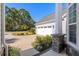 Garage and landscaping; house with a paved driveway and partial stone column at 5012 Lindrick Ct., Myrtle Beach, SC 29579