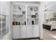 This hallway has a built-in bookcase with an assortment of decorations, books, and keepsakes at 5012 Lindrick Ct., Myrtle Beach, SC 29579