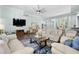Open living room with hardwood floors, a ceiling fan, and light blue paint at 5012 Lindrick Ct., Myrtle Beach, SC 29579