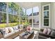 Screened-in back porch featuring outdoor furniture and view of the backyard at 5012 Lindrick Ct., Myrtle Beach, SC 29579