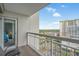 Balcony with a chair showcasing a partial view of the bedroom and the surrounding landscape at 9820 Queensway Blvd. # 1501, Myrtle Beach, SC 29572