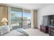 Balcony access from the living area offers beautiful beach views and lounging space at 9820 Queensway Blvd. # 1501, Myrtle Beach, SC 29572