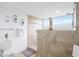 Modern bathroom featuring a glass-enclosed shower with tiled walls and a decorative seahorse accent at 9820 Queensway Blvd. # 1501, Myrtle Beach, SC 29572