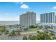 Coastal condo building with an ocean view, featuring a parking lot and easy access to the beach at 9820 Queensway Blvd. # 1501, Myrtle Beach, SC 29572