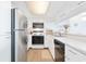 Clean, well-lit kitchen with white cabinetry, stainless steel appliances, and functional layout at 9820 Queensway Blvd. # 1501, Myrtle Beach, SC 29572