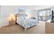 This main bedroom features access to the balcony and beautiful decor at 9820 Queensway Blvd. # 1501, Myrtle Beach, SC 29572