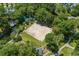 A sprawling sand volleyball court surrounded by lush trees at 9820 Queensway Blvd. # 1501, Myrtle Beach, SC 29572