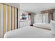 This bright bedroom has 2 beds, a TV, and beach-themed decor at 1501 S Ocean Blvd. # 1541, Myrtle Beach, SC 29577