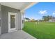A lovely backyard with green grass, showcasing the exterior of the house and the outdoor space at 2412 Campton Loop, Conway, SC 29527