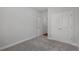 A bedroom featuring neutral carpet and a double door closet creating a blank canvas for personalization at 2412 Campton Loop, Conway, SC 29527