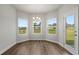 Bright breakfast nook with wood floors, stylish light fixture and views of the backyard at 2412 Campton Loop, Conway, SC 29527