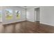 Spacious living room with wood floors, natural light, and neutral paint colors at 2412 Campton Loop, Conway, SC 29527