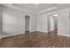 Large living area featuring beautiful wood flooring and ample space at 2412 Campton Loop, Conway, SC 29527