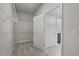 Walk-in closet with ample shelving and lighting, providing plentiful storage space at 2412 Campton Loop, Conway, SC 29527