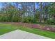 This backyard has a grassy lawn and mature trees at 2441 Campton Loop, Conway, SC 29527