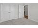 This bedroom has carpet flooring, a closet, and a white door leading to another room at 2441 Campton Loop, Conway, SC 29527
