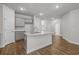 Modern kitchen with granite countertops, grey cabinets, stainless steel appliances, and island at 2441 Campton Loop, Conway, SC 29527