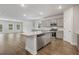 Open kitchen featuring stainless steel appliances, gray cabinets, granite counters and an island with sink at 2441 Campton Loop, Conway, SC 29527