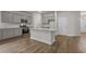 Modern kitchen featuring stainless steel appliances, a center island, and gray cabinetry at 2441 Campton Loop, Conway, SC 29527