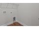 This laundry room has a vinyl floor, with hookups for a washer and dryer, and wire shelving at 2441 Campton Loop, Conway, SC 29527
