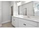 Bathroom with dual sinks, a large mirror, white cabinetry and a glass enclosed shower at 2472 Campton Loop, Conway, SC 29527