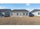 Back exterior of a home with siding and a grass yard at 2472 Campton Loop, Conway, SC 29527