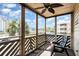 Screened balcony with a ceiling fan and views of the community and blue skies at 609 Hillside Dr. S # C-10, North Myrtle Beach, SC 29582