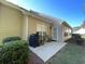 Inviting back patio featuring a grill, table, and chairs for outdoor entertaining at 620 Sunnyside Dr. # 102, Murrells Inlet, SC 29576