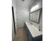 Well-lit bathroom featuring a long vanity with white countertop and ample cabinet space at 620 Sunnyside Dr. # 102, Murrells Inlet, SC 29576