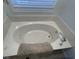 Relaxing soaking tub featuring jets and a cushioned headrest at 620 Sunnyside Dr. # 102, Murrells Inlet, SC 29576