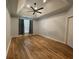 Bright bedroom with ample natural light, wood floors, and a ceiling fan at 620 Sunnyside Dr. # 102, Murrells Inlet, SC 29576