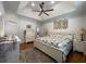 Spacious bedroom featuring a ceiling fan, wood floors, and neutral walls at 620 Sunnyside Dr. # 102, Murrells Inlet, SC 29576
