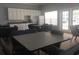 Multipurpose room for residents, featuring tables, chairs, and kitchenette at 620 Sunnyside Dr. # 102, Murrells Inlet, SC 29576